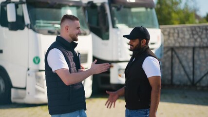 Diverse truck drivers shaking hands after business deal