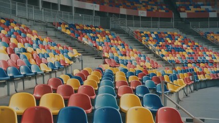 Empty stadium seating rows colorful rows of seats wide angle shot