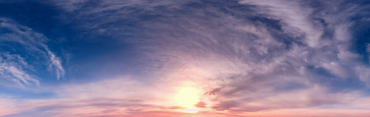 Serene Sunset Sky With Soft Clouds Over the Horizon in Warm Pink and Blue Tones