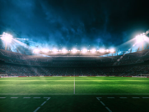 Professional football stadium at night with intense floodlights illuminating a perfectly maintained green grass field. Wide-angle sports arena scene with dramatic atmosphere and powerful lighting.