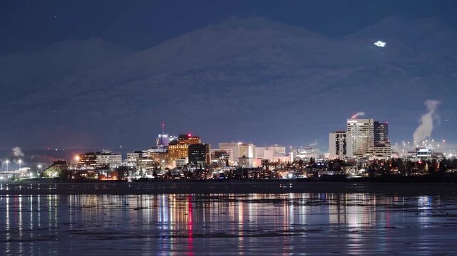 Anchorage Alaska skyline night timelapse with city lights and mountain backdrop