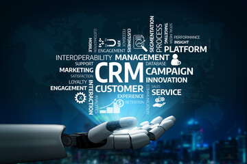 A futuristic robot hand reaching out against a digital backdrop filled with keywords related to customer relationship management, marketing, and business innovation. Tessel