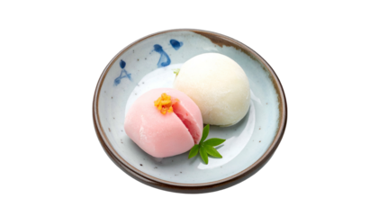 Pink and white sweets displayed on a small blue patterned plate