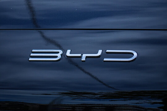 Chrome BYD lettering logo on the rear of a black electric vehicle representing the growing chinese automotive brand in the global ev market