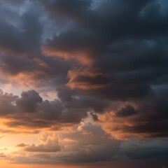Obraz premium Dramatic storm clouds glow with golden light at sunset for a powerful vista
