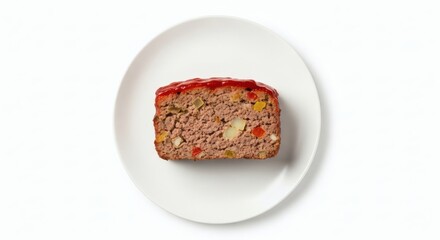 Overhead shot of meatloaf slice on white plate.