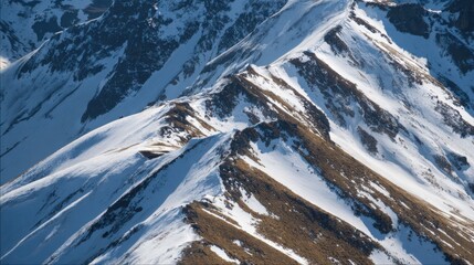 Majestic Snow-Capped Mountain Peaks Reflecting Winter Beauty Under Clear Blue Sky