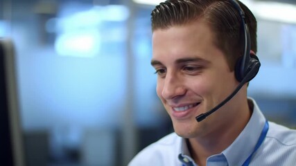 Close up of a friendly call center agent with a headset, smiling in a bright modern office. Providing customer service and technical support.
