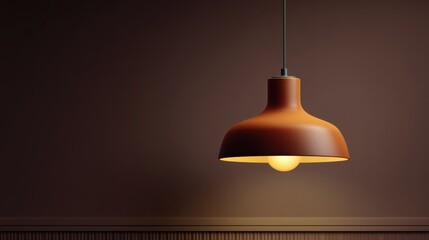 Obraz premium Modern pendant lamp with warm glow in minimalist interior setting showcasing stylish design against a rich brown wall background