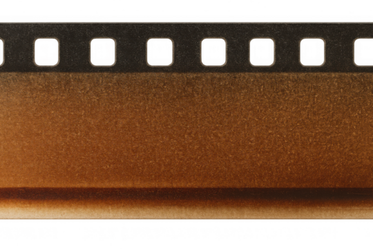 Vintage distressed film strip with sprocket holes and grain on a transparent background, depicting old movie production