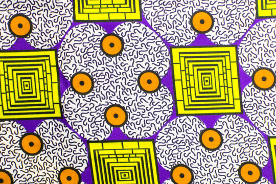 top view of white ankara fabric, flatlay of nigerian wax cloth with designs, spread out white ankara material