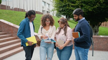 Diverse group of university students studying together on campus - Powered by Adobe