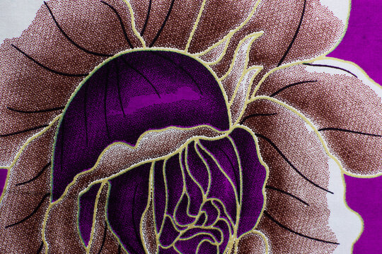 top view of purple ankara fabric, flatlay of nigerian wax cloth, rumpled purple ankara material
