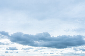 Overcast sky with distinct layers of blue gray stratocumulus clouds dominating the lower atmosphere