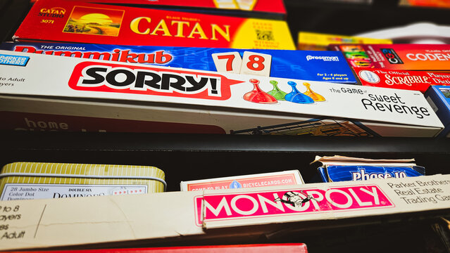A Close-up view of classic board games, including Monopoly, Sorry, Catan and more. For Editorial Use Only.