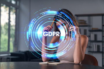 Smiling businesswoman in casual wear holding using smartphone typing at office workplace with notebook. Concept of distant work, business education. Data security hologram