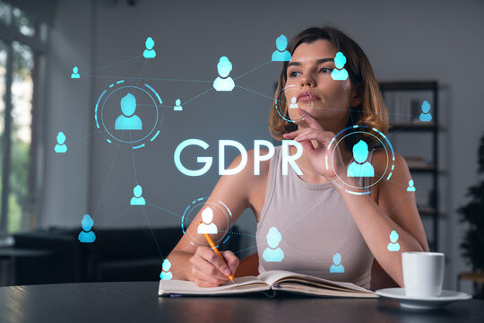 Smiling woman in casual wear taking notes in notebook at office workplace with coffee cup. Concept of distant business education, information technology, dreaming, thinking. data security drawings - Powered by Adobe