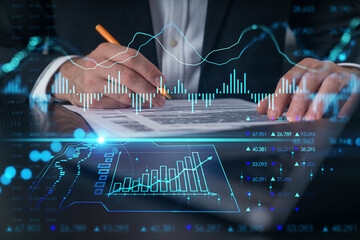 Woman typing on laptop at office workplace in background. Concept of working process, internet surfing, online business education. Student send e-mail. Close up view. Hands Shot. Stock market chart