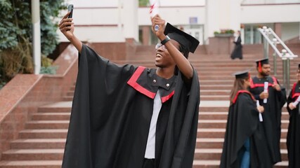 African American graduate taking selfie with diploma - Powered by Adobe
