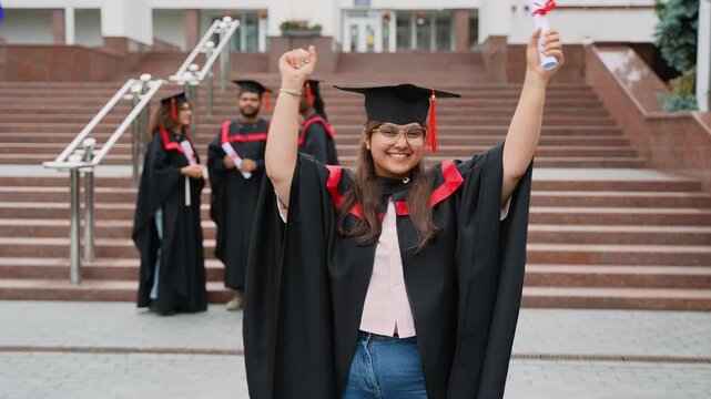 Successful Indian graduate celebrating her academic achievement