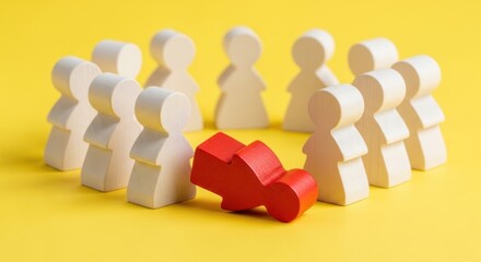 Wooden figures in circle with one fallen red figure on yellow background