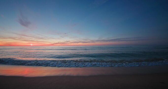 Scenic ocean sunrise or sunset over the sea horizon and tropical island beach, scenic seascape view