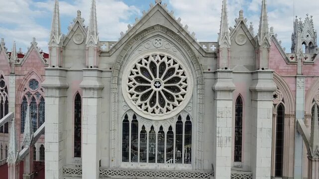 West side of the Expiatory Temple of the Sacred Heart of Jesus. Dolly out starting in the rose window. Leon, Guanajuato, Mexico