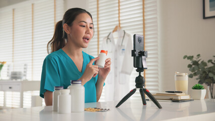 Asia woman people anti aging expert modern health care vlogger live advice talk selfie video mobile phone camera. Online retail diet weight loss digital virtual asian filming vitamin c pill drug store