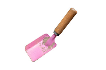 Pink gardening trowel with a wooden handle and dirt.