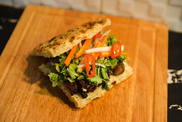 Vietnamese banh mi sandwich with grilled meat, cilantro, and pickled vegetables