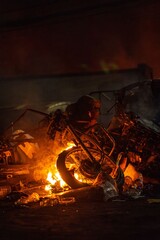 Motorbike on fire in the night 