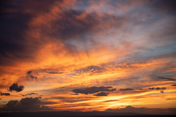 Fototapeta premium Expansive Wyoming sky with dramatic golden and orange clouds at sunset
