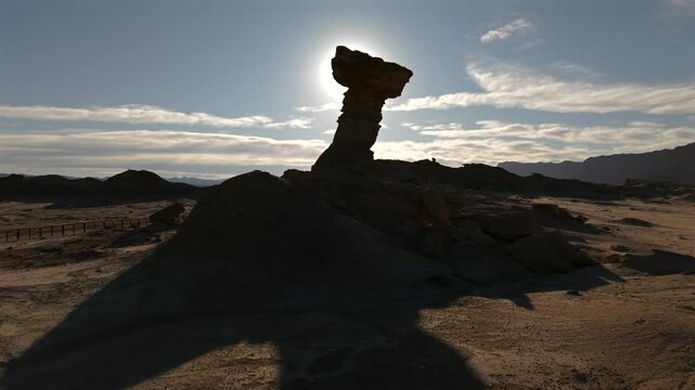 Aerial lateral drone view of El Hongo rock formation at Valle de la Luna, Ichigualasto, San Juan, Argentina.