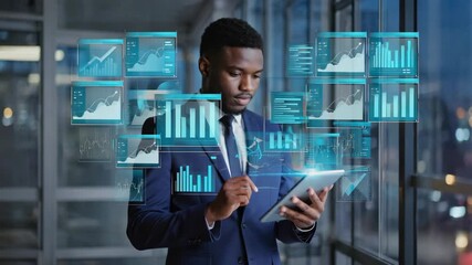 Generative AI. African American man in a business suit is using a tablet to analyze digital data with holographic graphs and charts displayed in a modern office environment showcasing technology - Powered by Adobe
