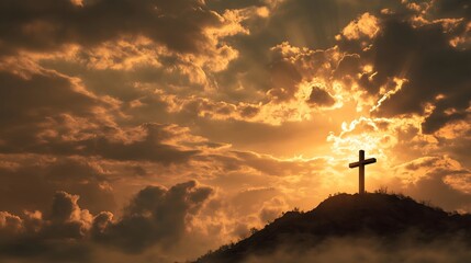 Fototapeta premium Cross on Hilltop Against Dramatic Sunset Sky