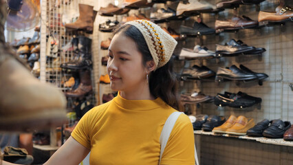 Young teen tourist Gen Z asia female choose look at zero waste eco go green buy second hand sale...
