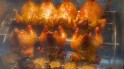 Footage of oven while roasting chickens. Roasting a chicken offers a variety of satisfying meal options throughout the week.