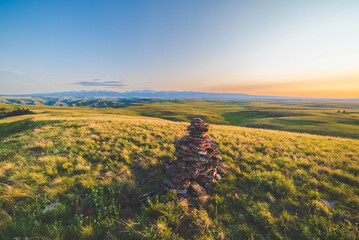 Cairn With Canyons And Mountains