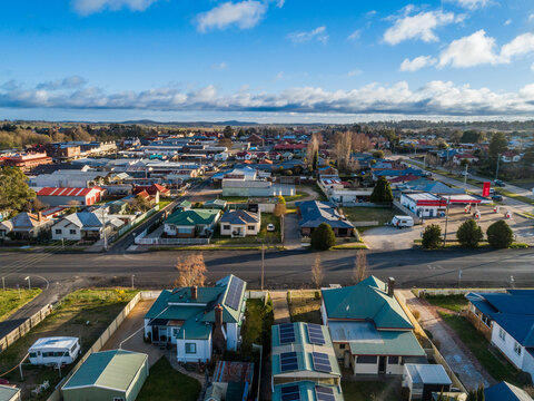 Soft morning light over houses in Glen Innes country town townscape with petrol station on corner