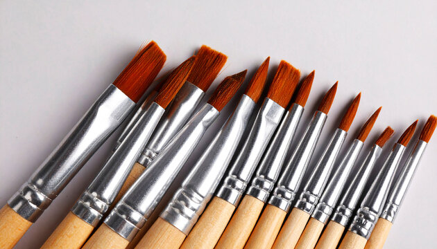 Geometric arrangement of paintbrushes as a flat lay highlights art tools design harmony