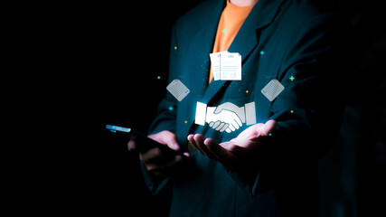 Businessman showing handshake icon, representing a successful negotiation or business deal between business partners in a professional corporate atmosphere, emphasizing agreement.