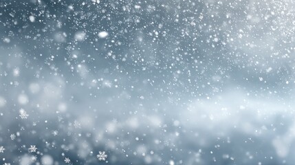 Gentle snowfall creates a serene winter scene with delicate snowflakes falling against a soft, blurred background, evoking a sense of calm and peace