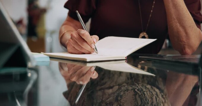 Person, hands and writing with diary for checklist, agenda or daily tasks on office desk. Closeup, employee or taking notes with book for schedule planning, reminder or record keeping in journal