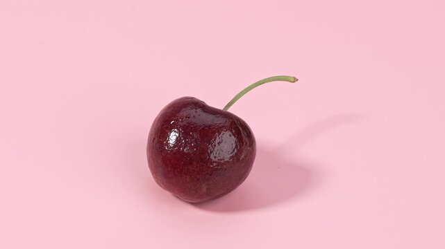 Fresh Red Cherry with Stem on Pink Background - Healthy Fruit Food Photography