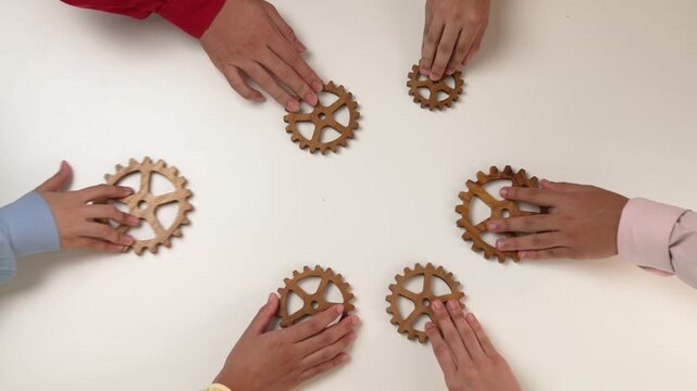 Panorama video of employee together connect wooden cogwheel gear symbol harmonious function productive system in business company and synergy teamwork with effective and efficiency working. Synergic