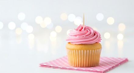 Delicious vanilla cupcake with vibrant pink buttercream frosting, elegantly placed on a charming pink checkered napkin against a soft, festive bokeh background.