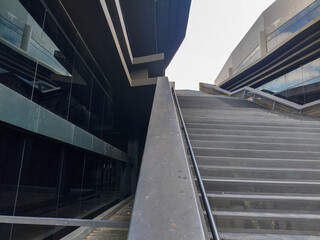 Futuristic and sleek modern building design meeting open green spaces and natural light