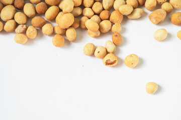 Coated Peanut Snack Scattered on White Background