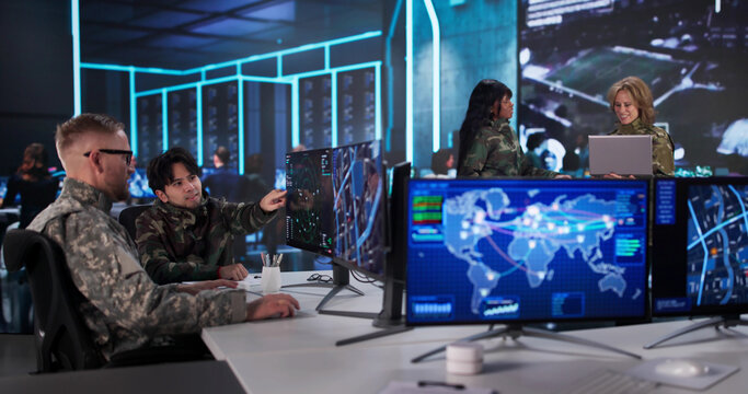 Military Data Center: Diverse Team Monitoring Intelligence - Powered by Adobe