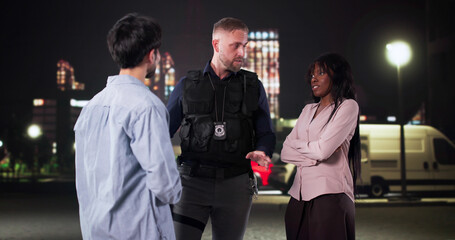 Police Officer Mediates Argument Between Diverse Couple